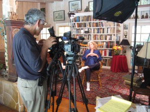Carl sets up side-by-side cameras in a standard two camera shoot, here with author and corporate consultant Nance Guilmartin.]