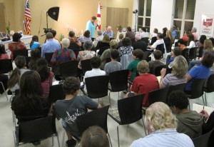 Kathy interviews former Parron Jungle horticulturalist Nat DeLeon in front a standing-room only crowd.