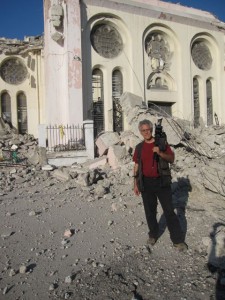 Cameraman Carl Hersh in front of the Port-Au-Prince National Cathedral, now a ruins.
