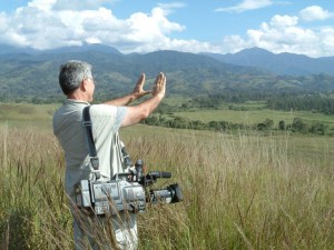 Taking the measure of the Wagi Valley in Papua New Guinea's central highlands. At the ready, a shoulder-held camcorder. 